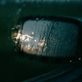 rain soaked rearview mirror