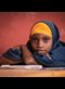 a portrait of a girl sitting at a desk