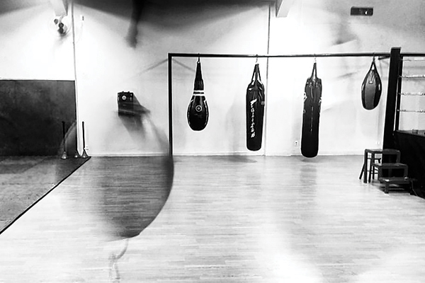 black and white photograph of a boxing gym