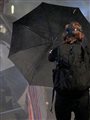 a woman holding a black umbrella