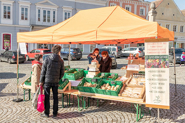 a farm stand in an Austrian town square