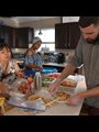 people preparing a meal in a sunny kitchen