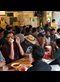 people eating at long tables