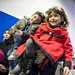 A Syrian father and his children wait in line to have their passports checked at Hanover airport in Germany.