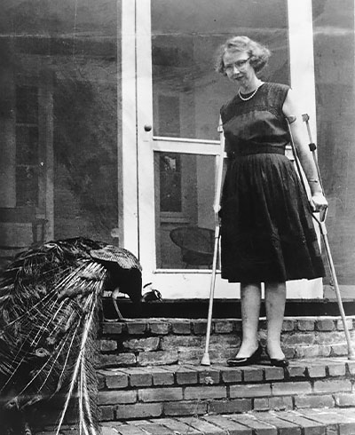 photo of Flannery OConnor with a peacock