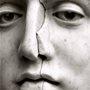 cracked face of a marble statue