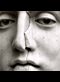 cracked face of a marble statue