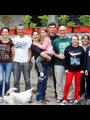 group of happy people standing together
