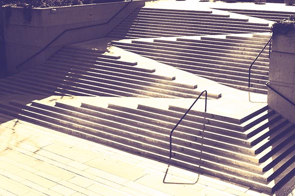 An outdoor staircase in Robson Park, Vancouver, incorporates a ramp for wheelchairs and strollers.