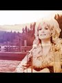photo of the Smoky Mountains overlaid with a picture of Dolly Parton