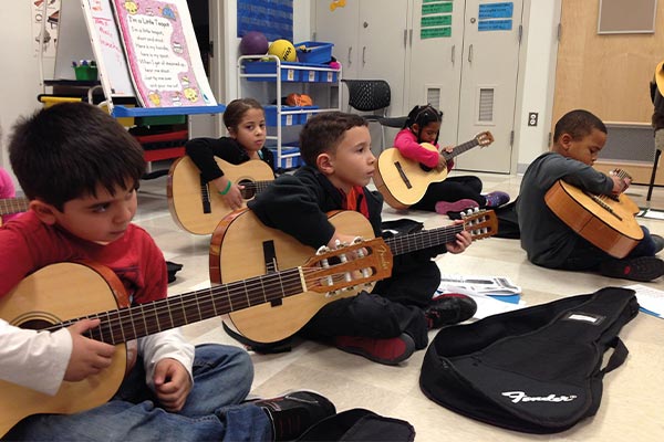 kids playing guitars