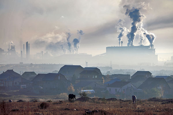 factory smokestacks with grey smog