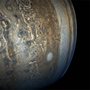 tan and blue swirls and patterns in the clouds of Jupiters atmosphere