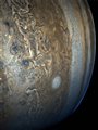 tan and blue swirls and patterns in the clouds of Jupiters atmosphere