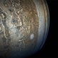 tan and blue swirls and patterns in the clouds of Jupiters atmosphere