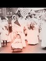 old photograph of suffragettes, one of them pushing a baby in a stroller