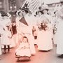 old photograph of suffragettes, one of them pushing a baby in a stroller