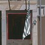 painting of an American flag hanging outside a door