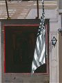 painting of an American flag hanging outside a door