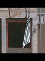 painting of an American flag hanging outside a door
