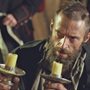 Hugh Jackman as Jean Valjean with two candlesticks