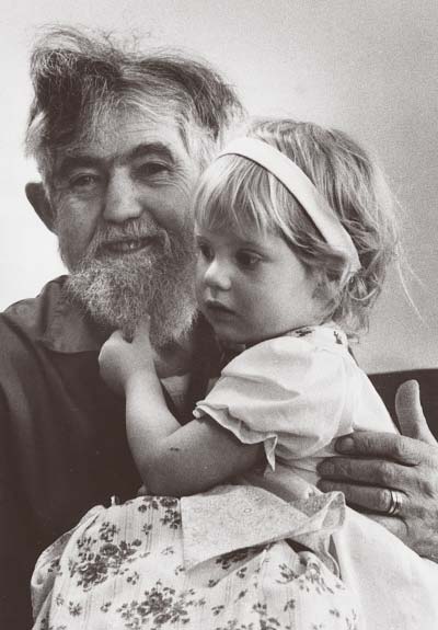 photo of an old bearded man with his granddaughter