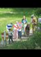 kids dressed as knights and ladies walking along a path