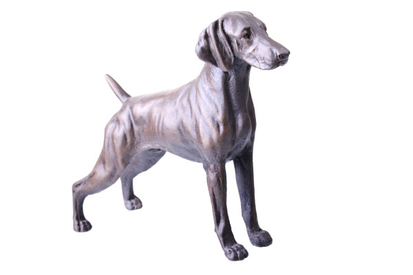 metal figurine of a dog standing