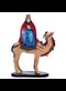 painted carving of a king on a camel
