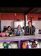 three women standing at a kitchen counter