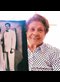 smiling old lady holding a wedding photo