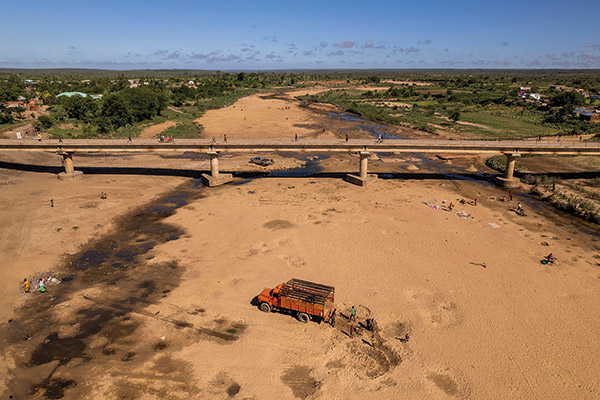 a truck parked on the dried river bed of the Manambovo River