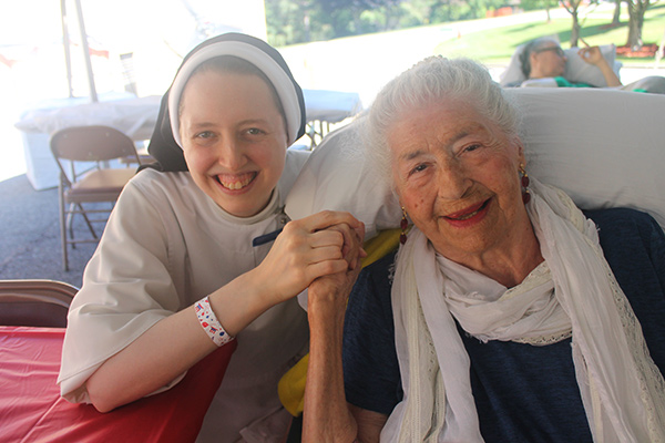 a religious sister and an elderly woman