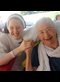 a religious sister and an elderly woman