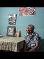 an old man sitting at a table