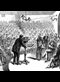 illustration of Alexander Graham Bell demonstrating his experimental telephone