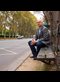 portrait of Tim Keller sitting on a bench