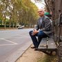 portrait of Tim Keller sitting on a bench