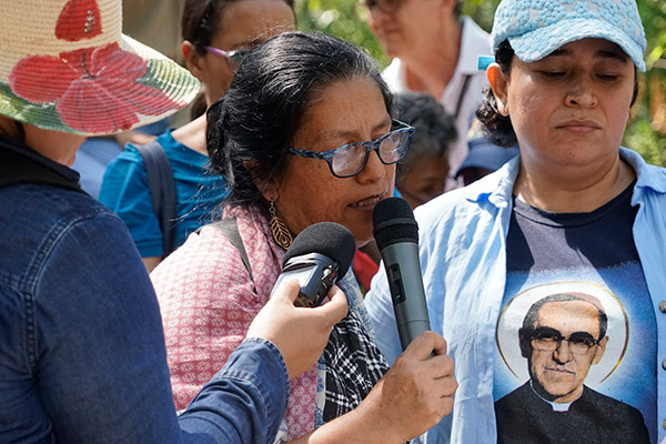 A woman speaks during the Stations of the Cross walk honoring martyrs, land activists, and political dissidents near El Progreso, Honduras