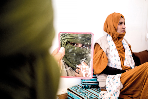 two women preparing for a demining operation