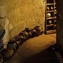 a dark hallway filled with ceramic pots