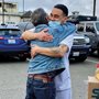 a prisoner embracing his father minutes after his release