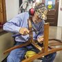 a man fixing a chair