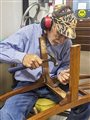 a man fixing a chair