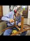 a man fixing a chair