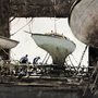 painting of men repairing boats