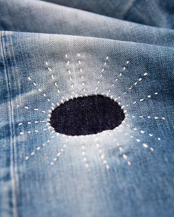 decorative mending on denim