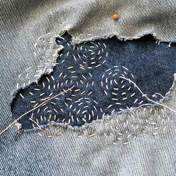 decorative mending on denim