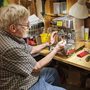 a man fixing a coffee maker