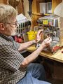 a man fixing a coffee maker